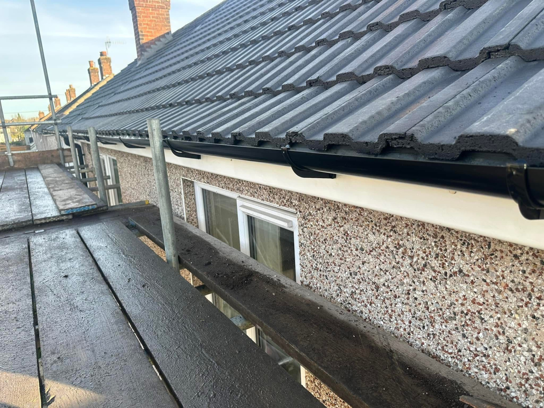 New concrete tile roof being installed on a house in Romsey.